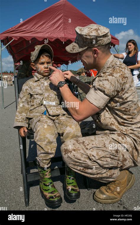 Cpl Scott J Supranowicz 5 Applies Camouflage Paint To Ryan C