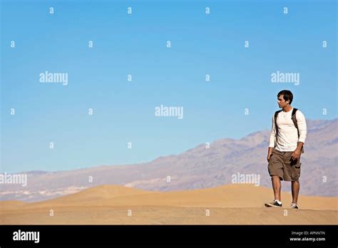 Young Man Hiking In Desert Stock Photo Alamy