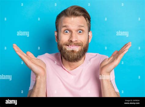 Photo Of Funky Doubtful Young Guy Dressed Pink T Shirt Rising Arms