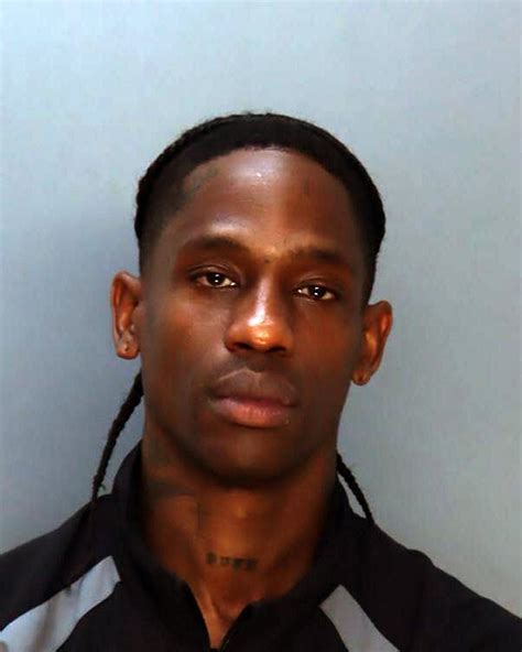 Rapper Travis Scott selling T-shirts featuring his mugshot after his