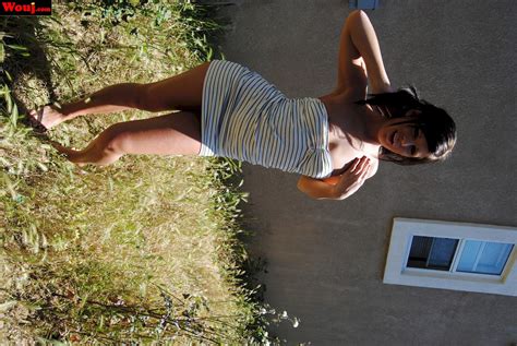 Lovely Brunette Babe Posing In A White Dress Outdoors Photos