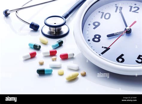 Clock with medicine and medical stethoscope on white background Stock ...