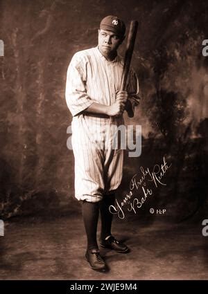 Babe Ruth Full Length Portrait Standing Facing Slightly Left In Baseball Uniform Holding