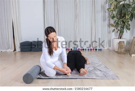 Traditional Shiatsu Massage Done By Mature Stock Photo