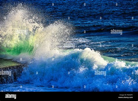 Large Sea Waves Hitting The Rocks Stock Photo Alamy