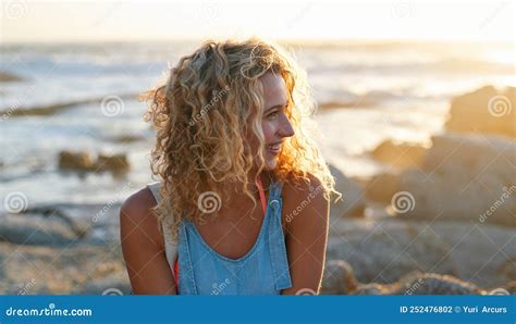 Portrait Attractive Blonde Woman On Beach At Sunset Smiling Enjoying