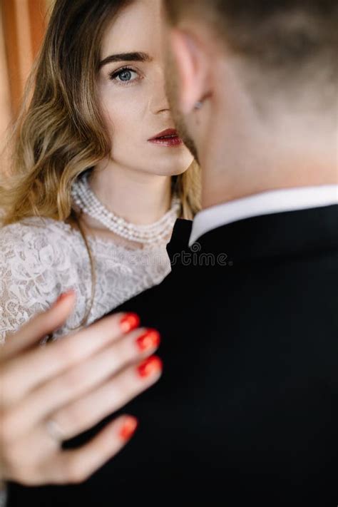 Wedding Couple Indoors Is Hugging Each Other Beautiful Bride In Stock