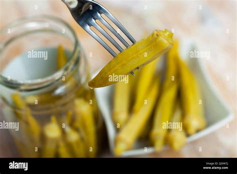 Fork With Impaled Pickled Okra Pod Stock Photo Alamy
