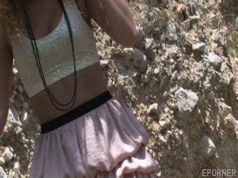 Curly Babe Undresses Outdoors