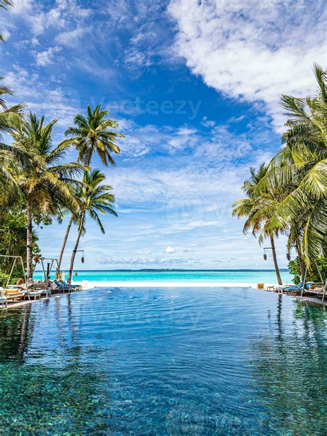 Tropical beach resort pool in a luxurious beachfront hotel resort at