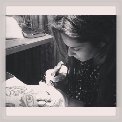 Cheryl Cole shares Instagram photos of her tattooing her tattoo artist