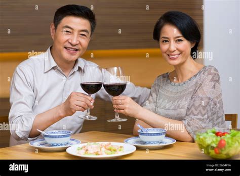 Mature Couple Toasting Stock Photo Alamy