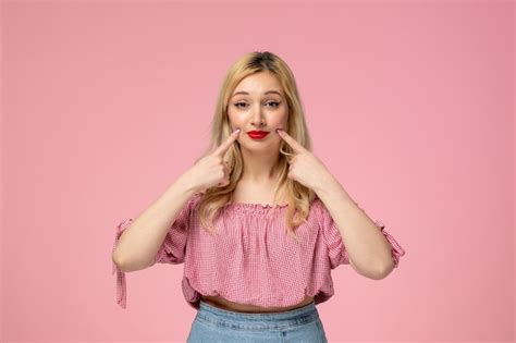 Free Photo Cute Girl Pretty Blonde Lady Wearing Red Lipstick In Pink Blouse Holding Cheeks