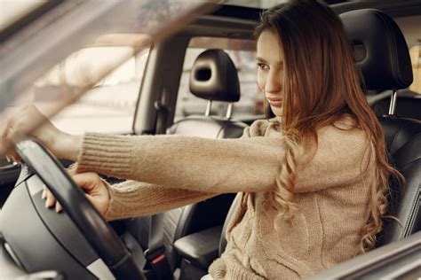 focused modern woman driving car  stock photo