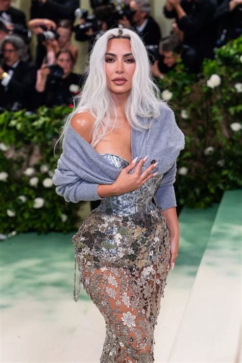 Kim Kardashian flaunts tiny waist as fans 'spot clue' she got 'rib