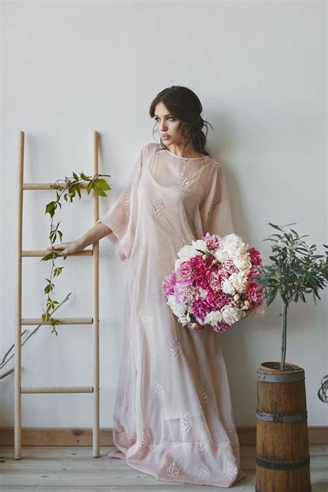 Beautiful Brunette Model Girl With Seductive Full Lips And With Closed Eyes In The Stylish Dress