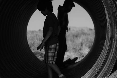 premium photo boys walking  pipe