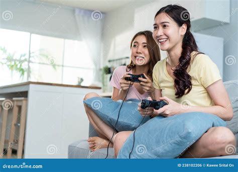 Asian Beautiful Lesbian Woman Couple Enjoy Play Game Together In House Attractive Two Female