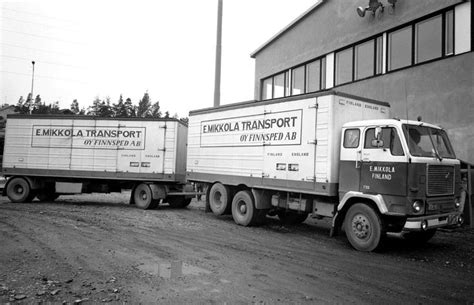 Vintage Volvo Trucks Parked In Front Of A Building