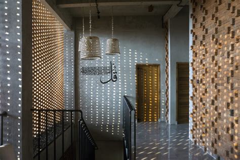 andyrahman architect designs  javanese inspired red brick house