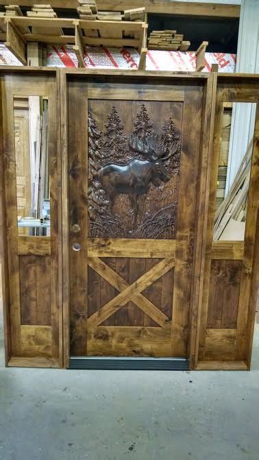 Knotty Alder Door With Carved Moose Panel And Sidelights