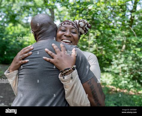 Smiling Mature Couple Hugging In Forest Stock Photo Alamy