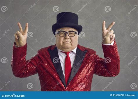 Portrait Of Funny Serious Rich Senior Man In Top Hat And Sequin Jacket