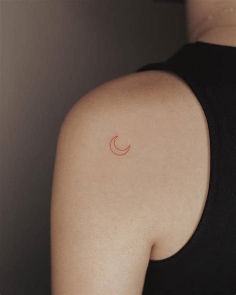 Minimalist Red Crescent Moon Tattoo Located On The