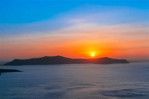 Premium Photo | Fira at sunset, santorini, greece