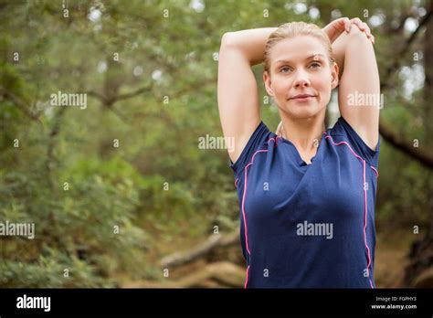 Athletic Blonde Stretching Arms Stock Photo Alamy
