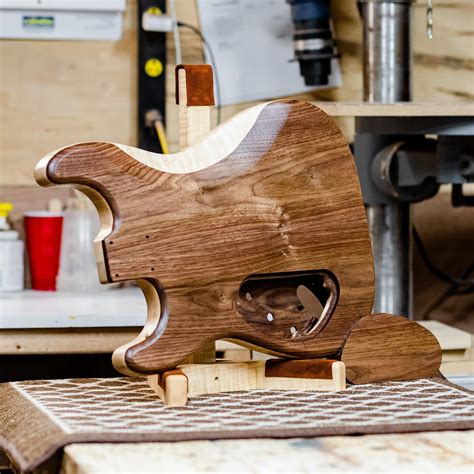 My first custom body for 2024; Strat body with a Walnut top & back with