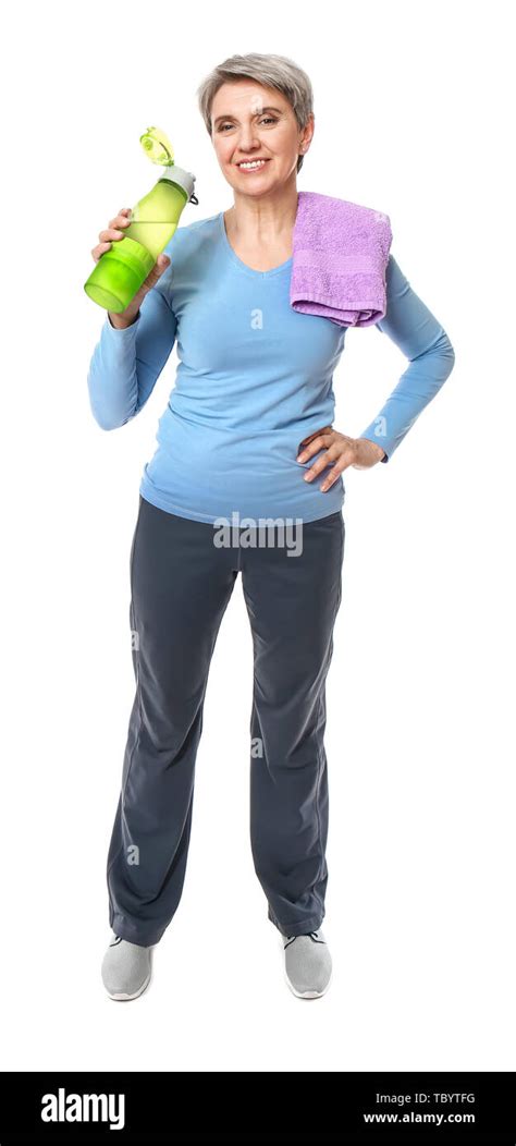 Sporty Mature Woman With Towel And Bottle Of Water On White Background
