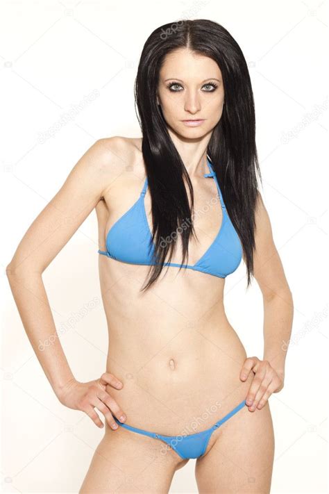 Sexy Black Haired Slim Woman In Blue Micro Bikini On White Isolated Background Stock Photo