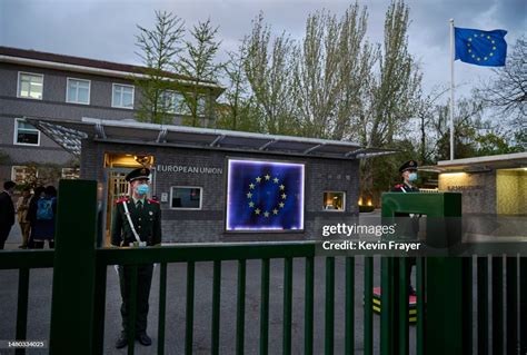 Members Of The Peoples Armed Police Stand Guard In Front Of The Flag