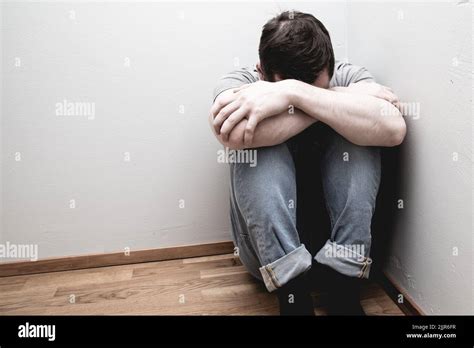 A Photo Of Scared Man In Corner Of The Room Stock Photo Alamy