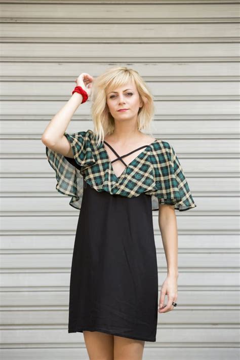 Portrait Of Beautiful Fashionable Long Blonde Hair Girl Wearing Elegant Dress In Front Of