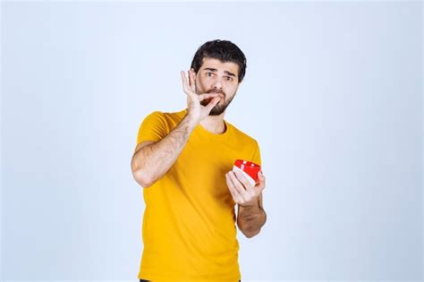 Free Photo Man Holding A Coffee Mug And Enjoying The Taste