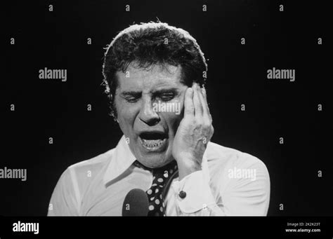 French Singer Gilbert Bécaud Performing At The Paris Olympia During