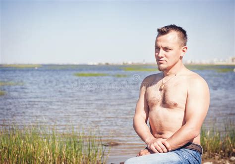 Handsome Man With Naked Torso Sitting Near The Sea Stock Photo Image Of Happy Athletic
