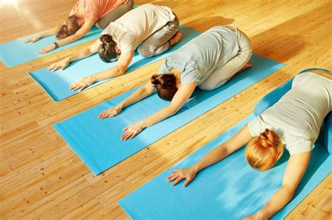 Group of People Doing Yoga Exercises at Studio Stock Image - Image of ...