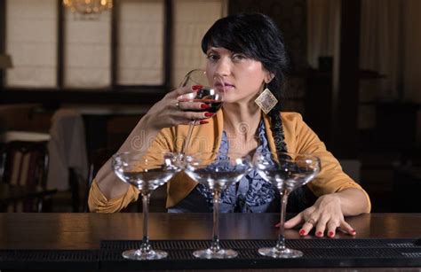 Young Woman Drinking Alone At A Bar Stock Image - Image: 35465951