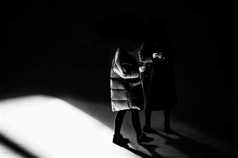 Premium Photo Two People Standing Indoors