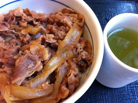 Steaming Hot Rice Topped With Savory Slices Of Seared Beef Donburi