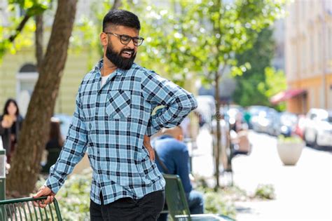Indian Mature Man Touching Injured Sore Back Backache Suffering Lower Lumbar Discomfort Muscle
