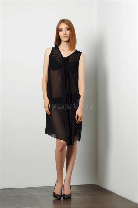 Fashion Model In Black Lingerie And Transparent Negligee Bare Legs And High Heels Stock Image