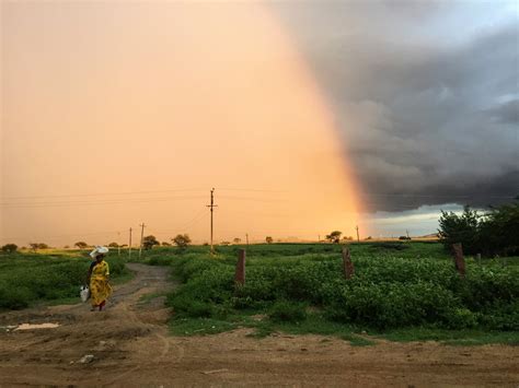 An unexpected rainbow while I was driving through rural India. A lady