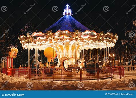 Beautiful Bright Carousel In Park At Night In Winter Stock Image