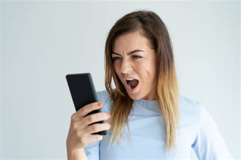 Free Photo Angry Woman Shouting At Smartphone Indignant Lady Using