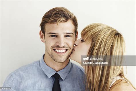 Peck On The Cheek High-Res Stock Photo - Getty Images