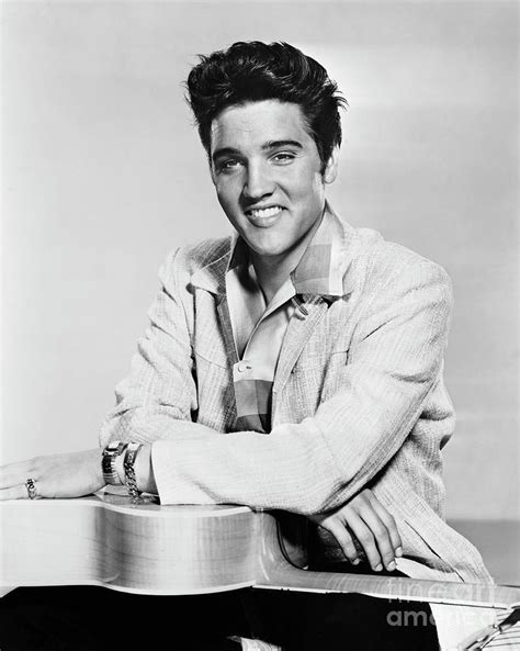 Elvis Presley With Guitar by Bettmann